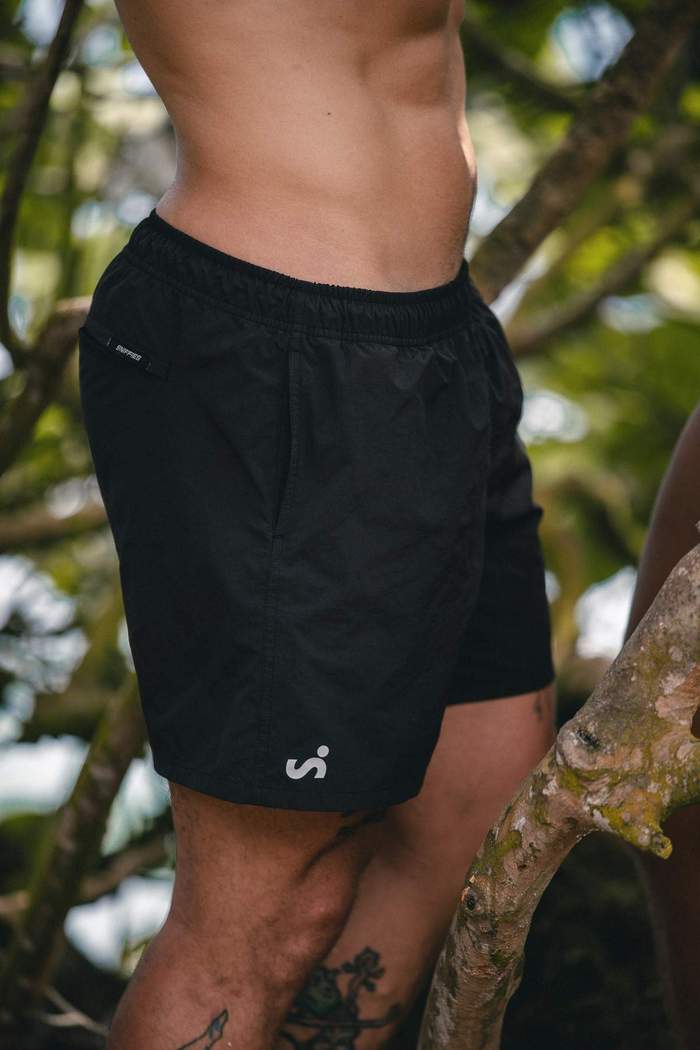 Close-up of black Sniffies cargo swim trunks during the Sniffies Summer Swim Collection campaign in Puerto Rico