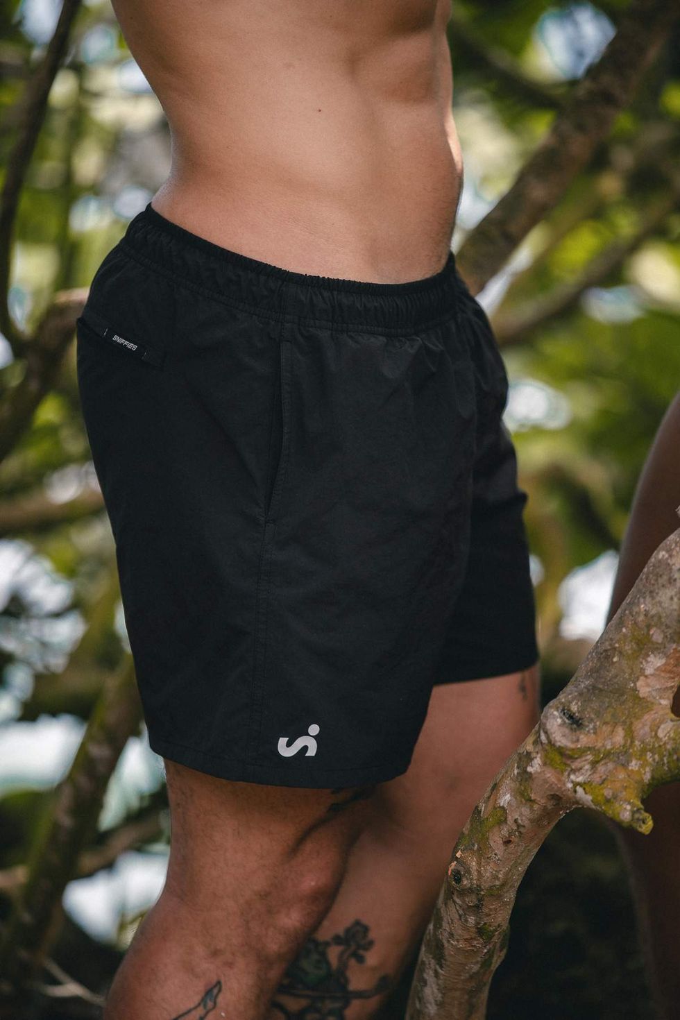 Close-up of black Sniffies cargo swim trunks during the Sniffies Summer Swim Collection campaign in Puerto Rico