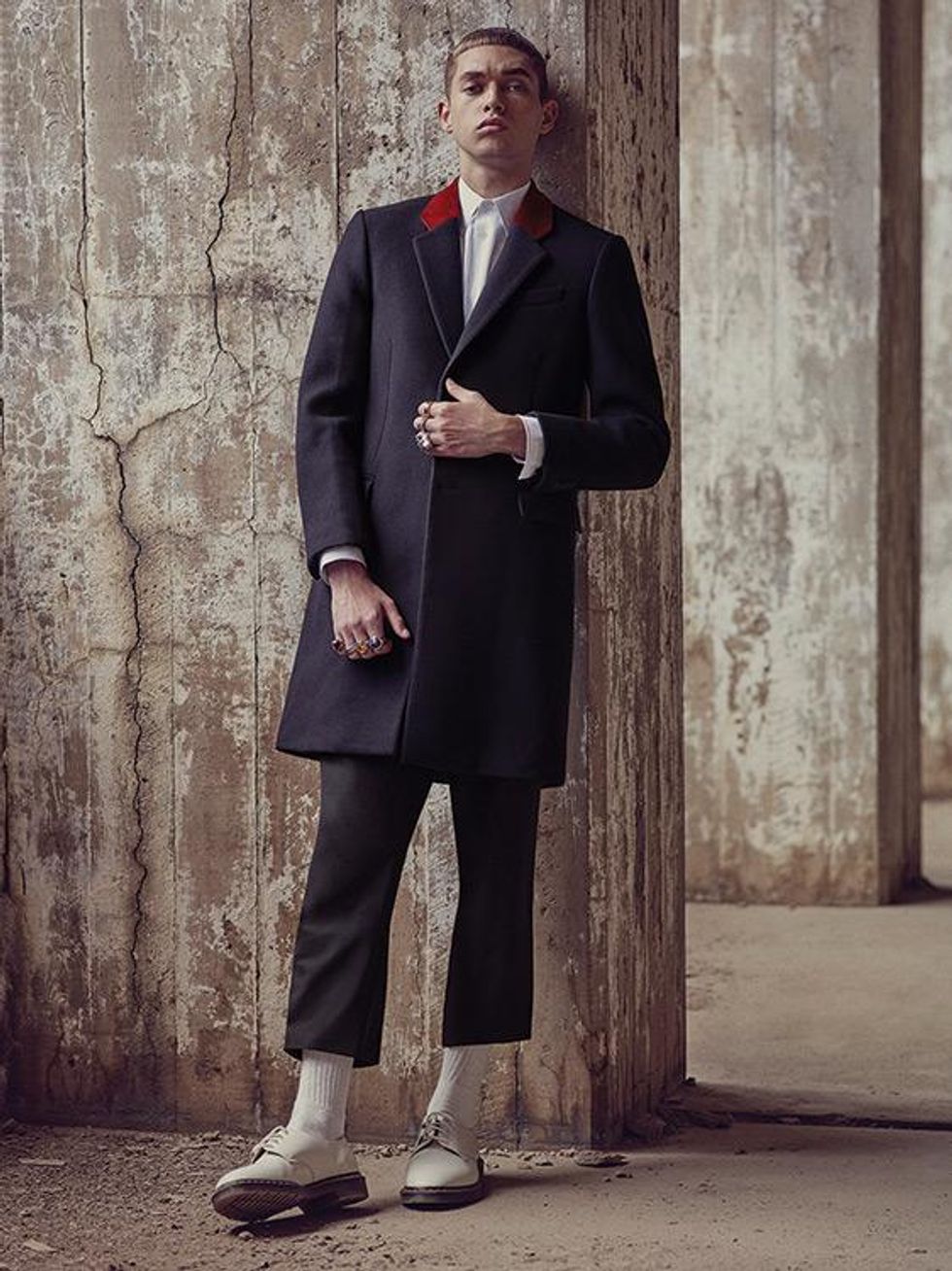 Coat, shirt, and pants by Tommy Hilfiger. Socks by Champion. Shoes by Dr. Martens.