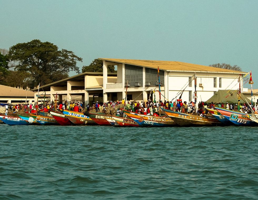 Conakry Guinea crowd waiting to board boats