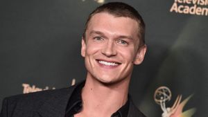 Connor Storrie rocks his new signature buzzcut at Emmys red carpet