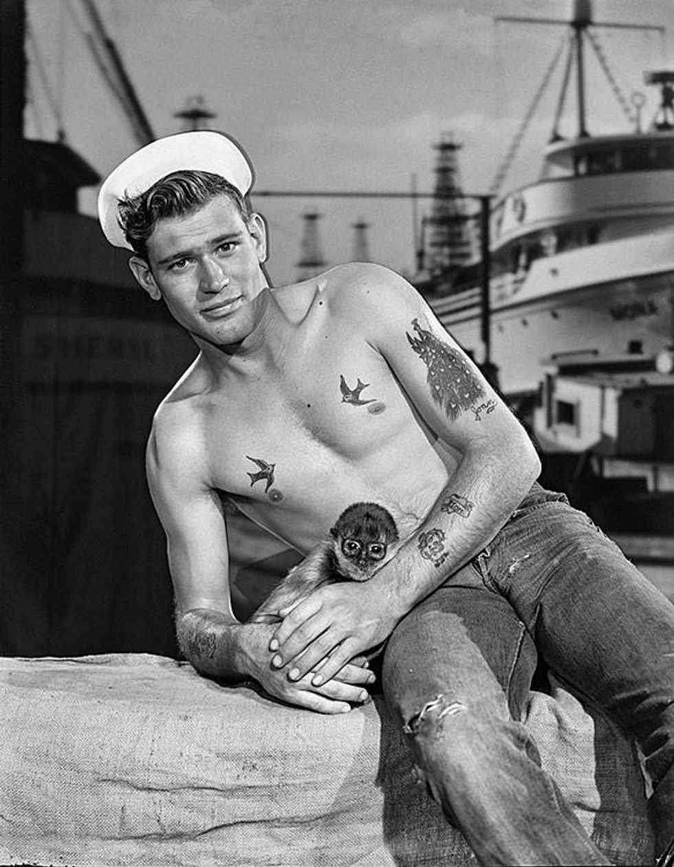 Copyright: (c) The Bob Mizer Foundation, Inc. (Eddie Taylor and monkey, 1954)