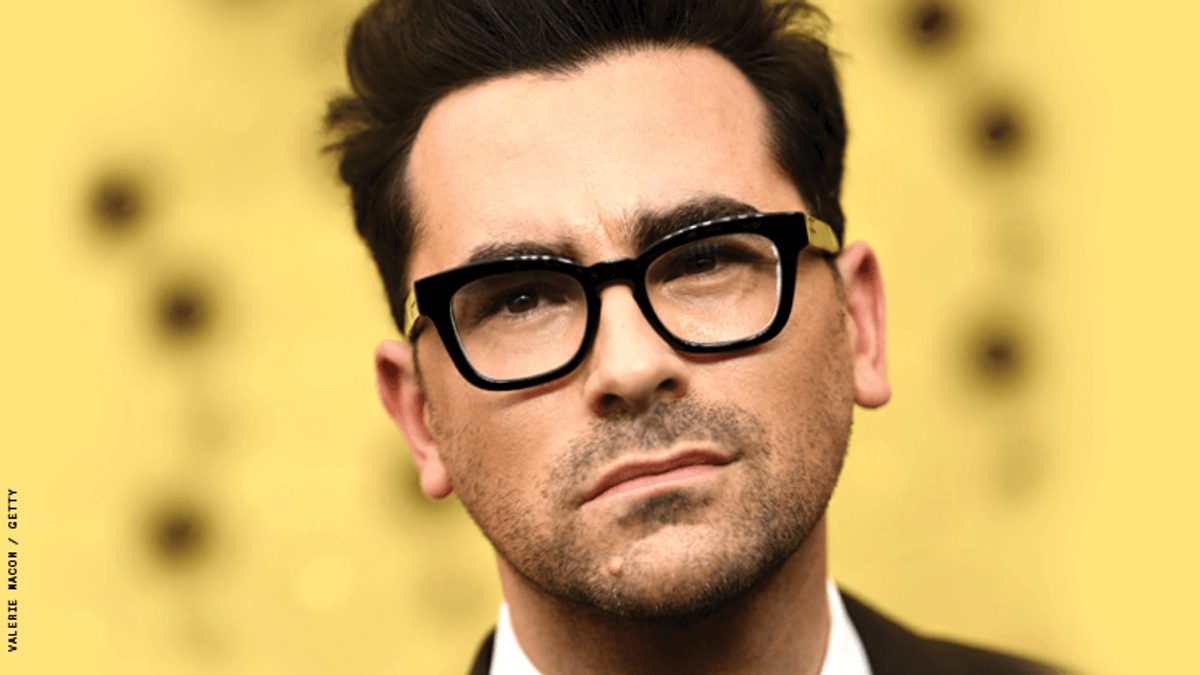 Dan Levy on a red carpet.
