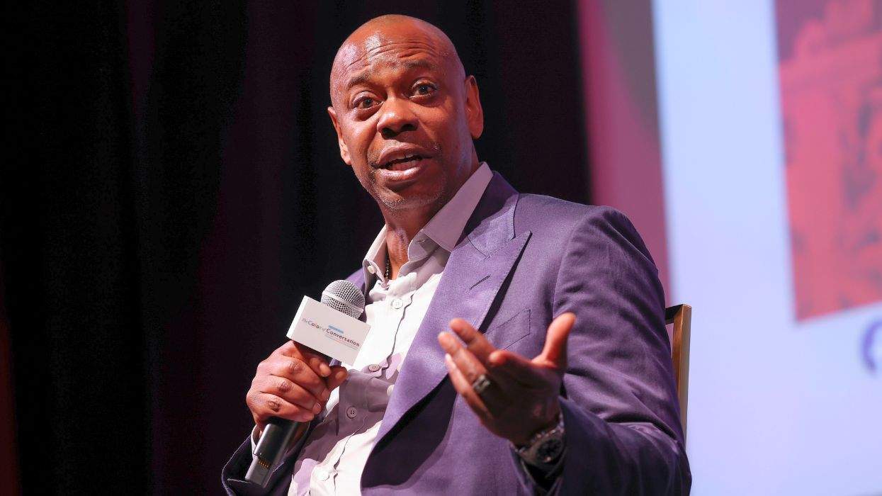 Dave Chappelle speaks on stage during a film festival