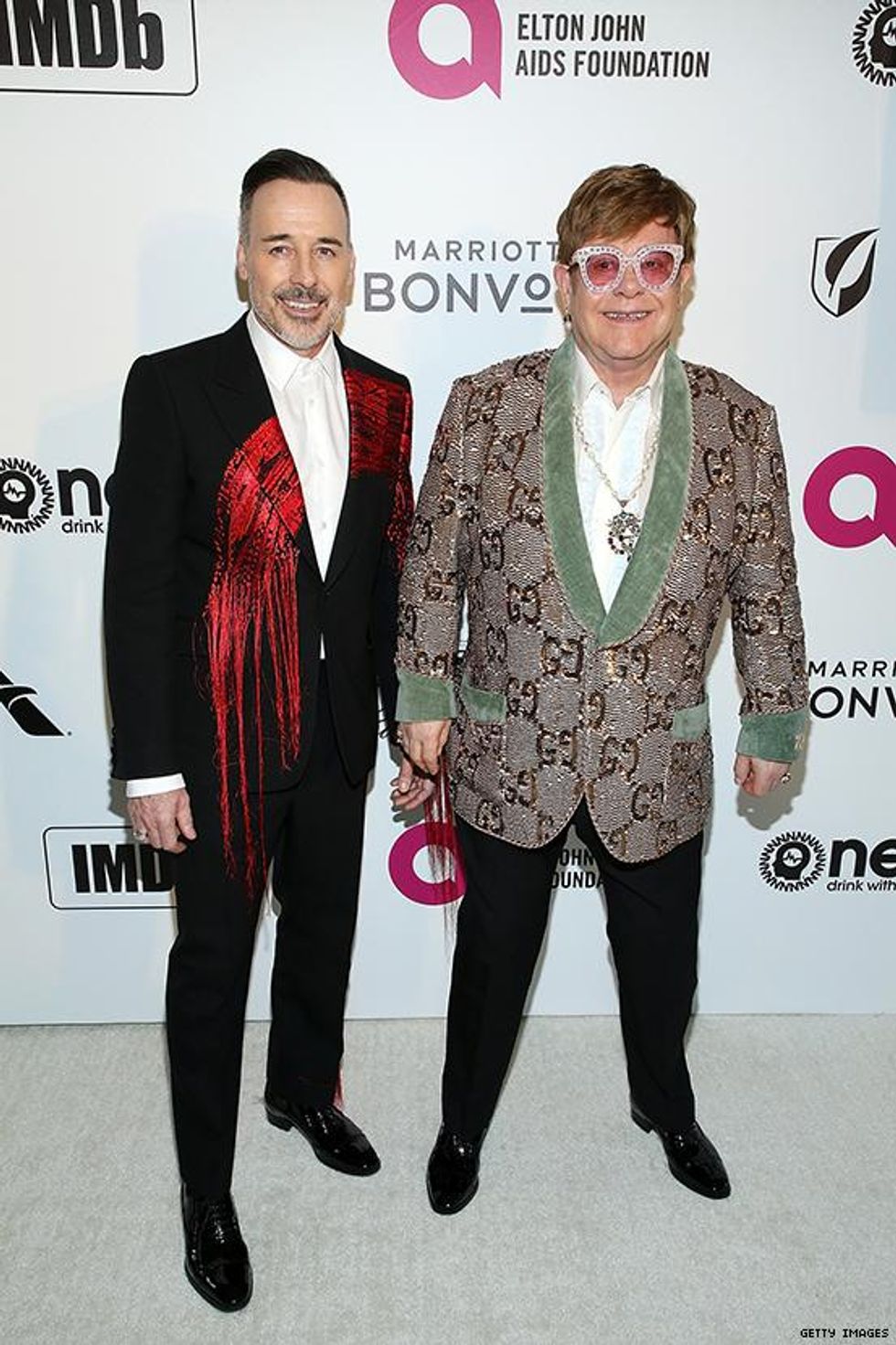 David Furnish and Elton John in Gucci at the Elton John AIDS Foundation Academy Awards Viewing Party