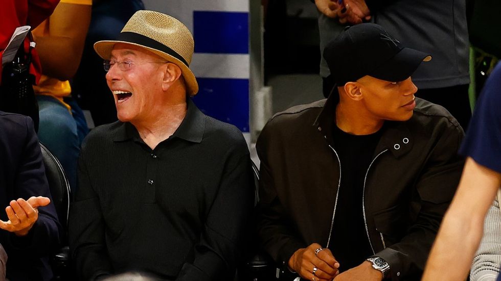 David Geffen and David Armstrong aka Donovan Michaels at a basketball game