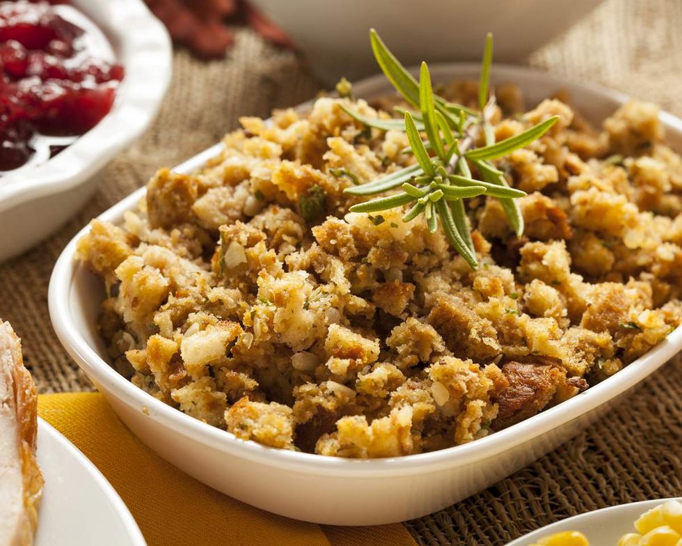 dish of stuffing with sprig of rosemary