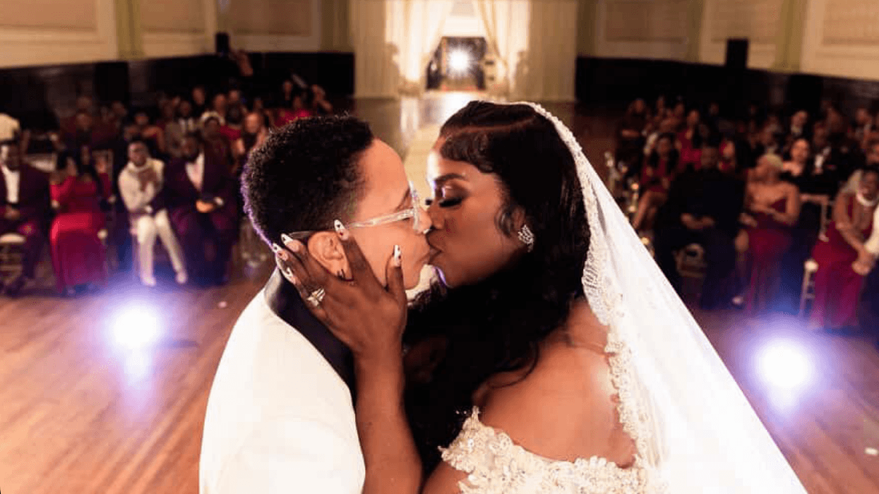 Dr. Tara Jae and RaeShanda Lias kiss on the altar at the wedding