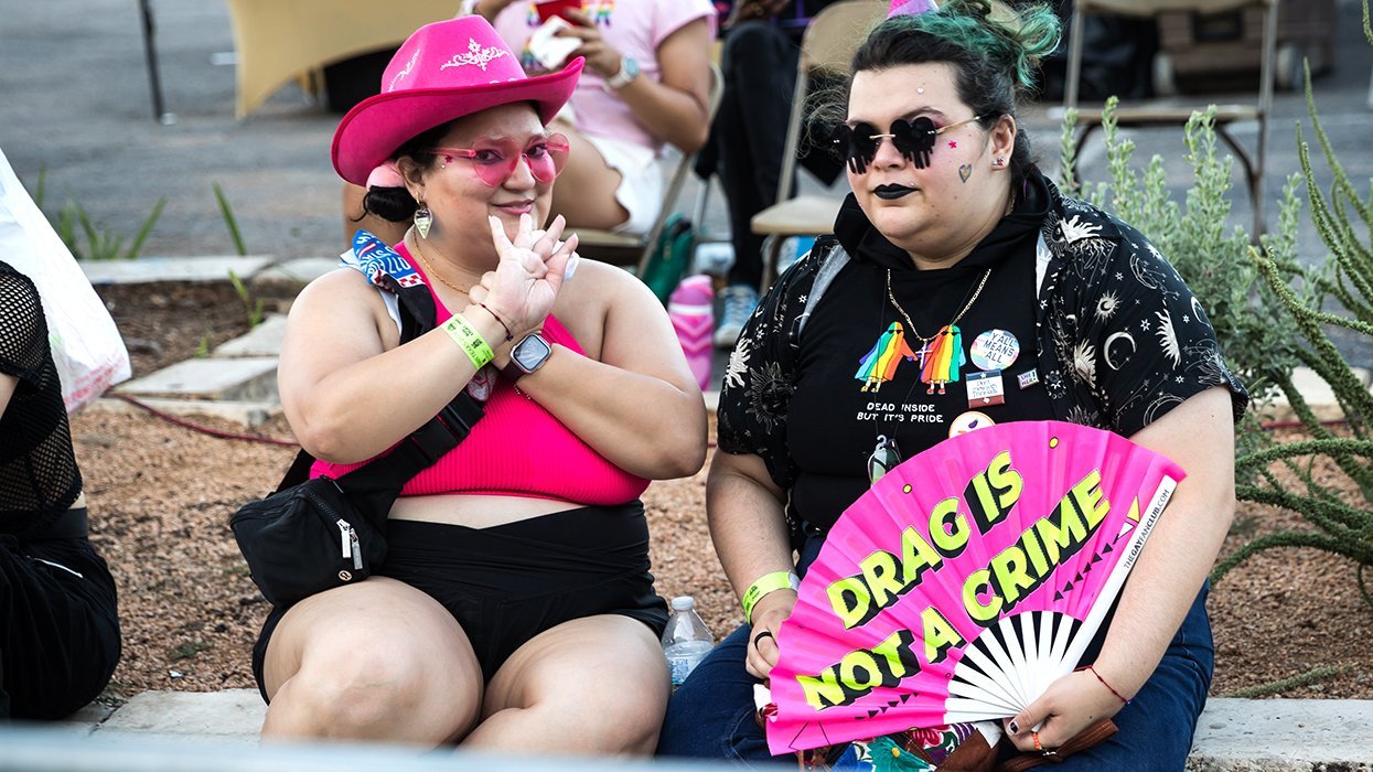 Drag is not a crime fan people waiting for 2024 Pride Bigger Than Texas Night Parade to begin in San Antonio Texas