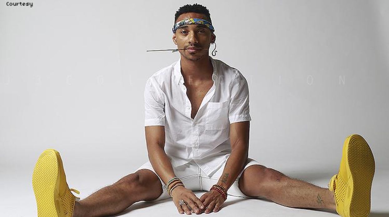 Durand Bernarr, viral singer, sitting on the floor in a white t-shirt.