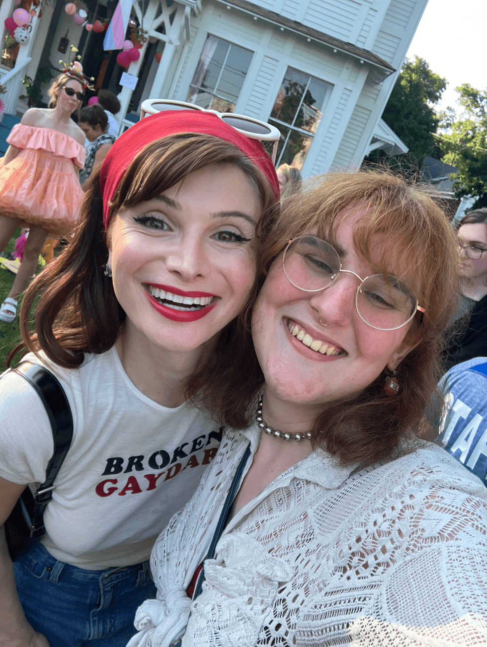 Dylan Mulvaney and Juniper Kristal Starling smile for a selfie at the Summer of Sass Strawberry Social in Provincetown.