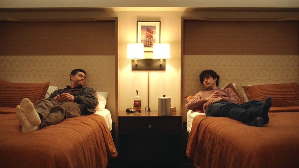 Dylan O'Brien as Roman and James Sweeney as Dennis in Twinless