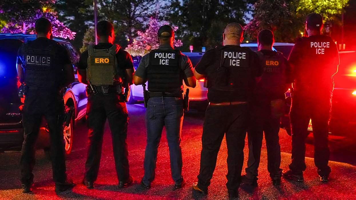 ERO deportation officers shown from behind wearing enforcement gear from the Baltimore MD office
