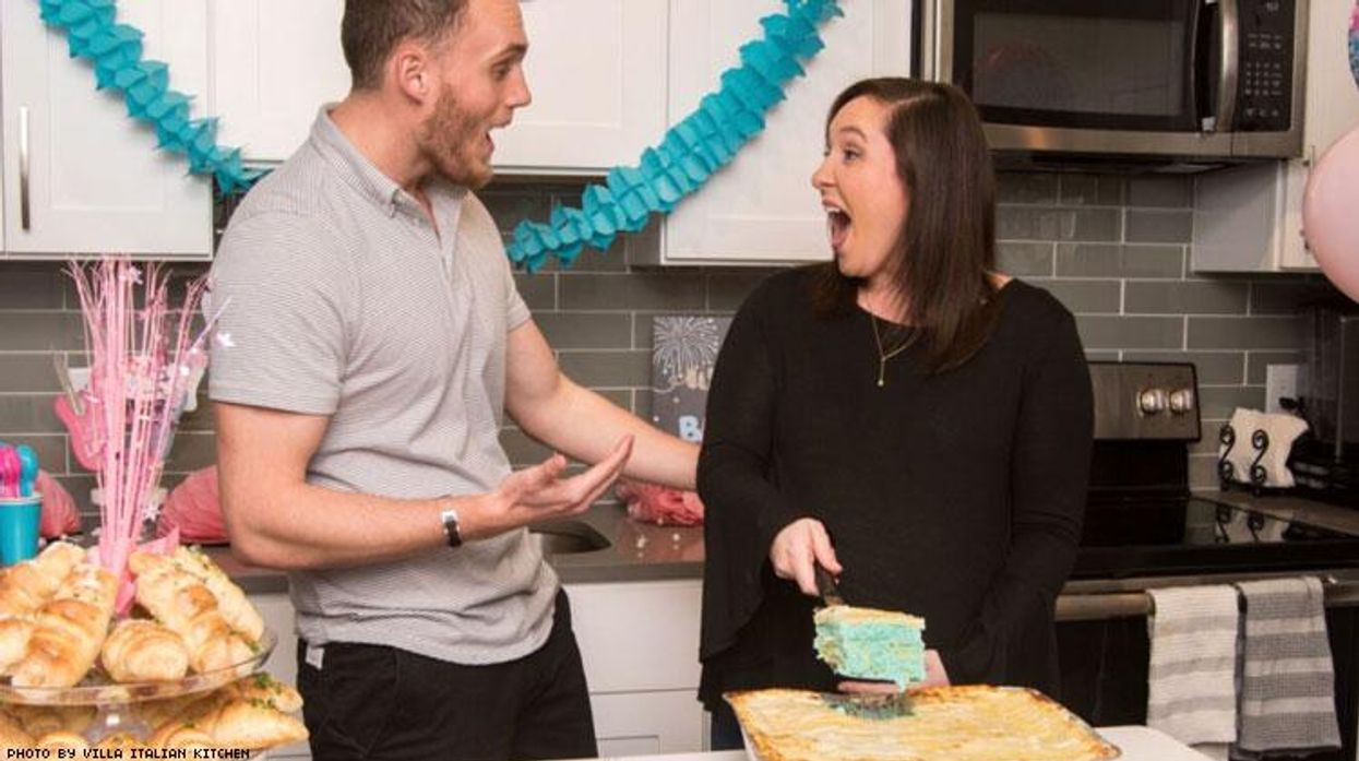 Expecting parents with their birth reveal lasagna