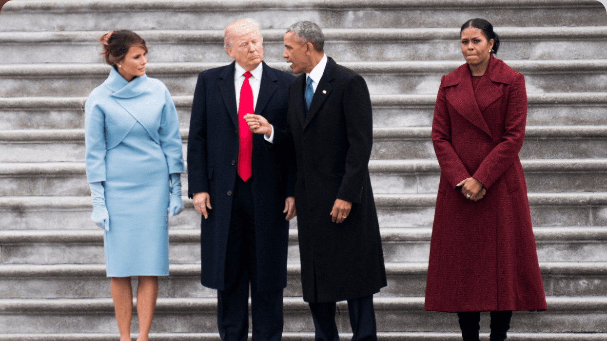 Four people standing on stairs