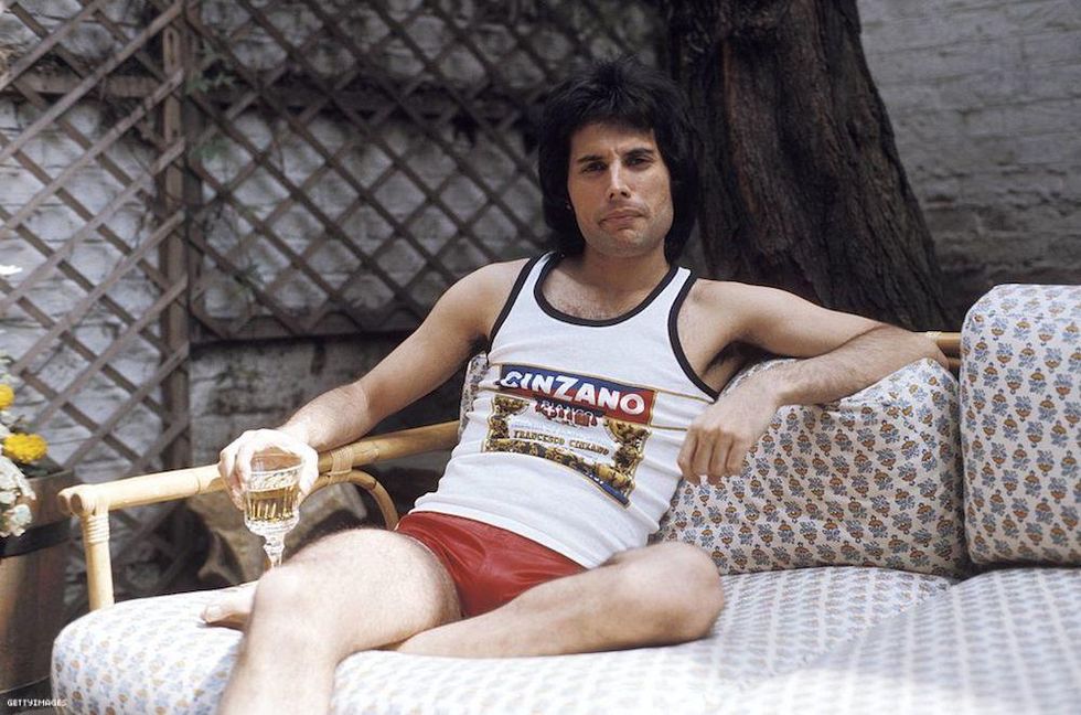 Freddie Mercury sitting on a couch