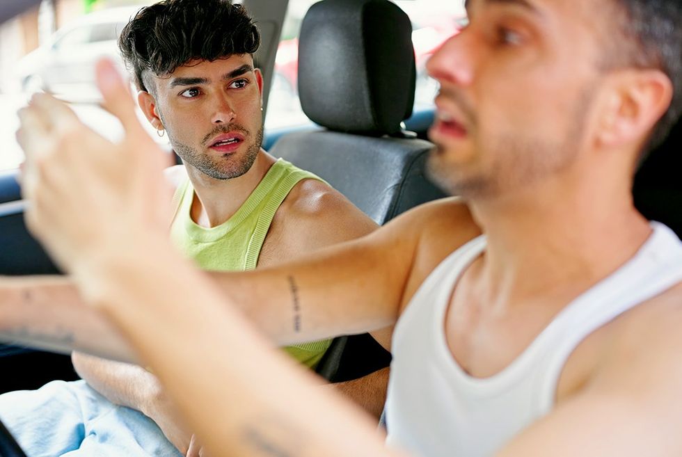 gay couple disagreeing in the car