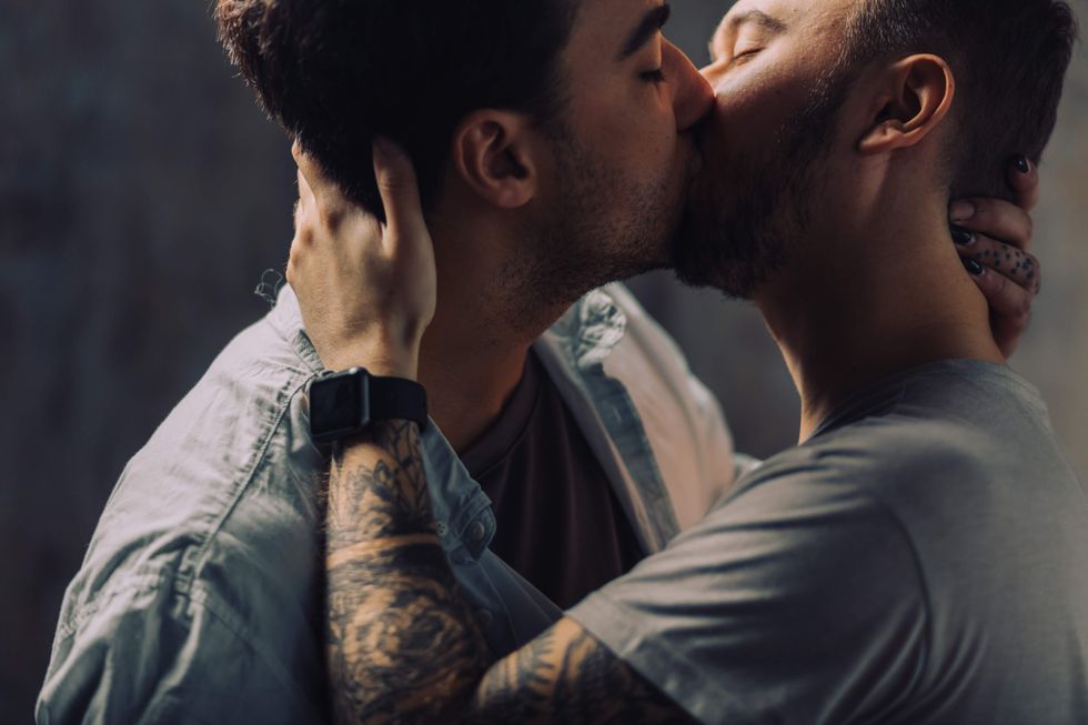 Gay couple kissing