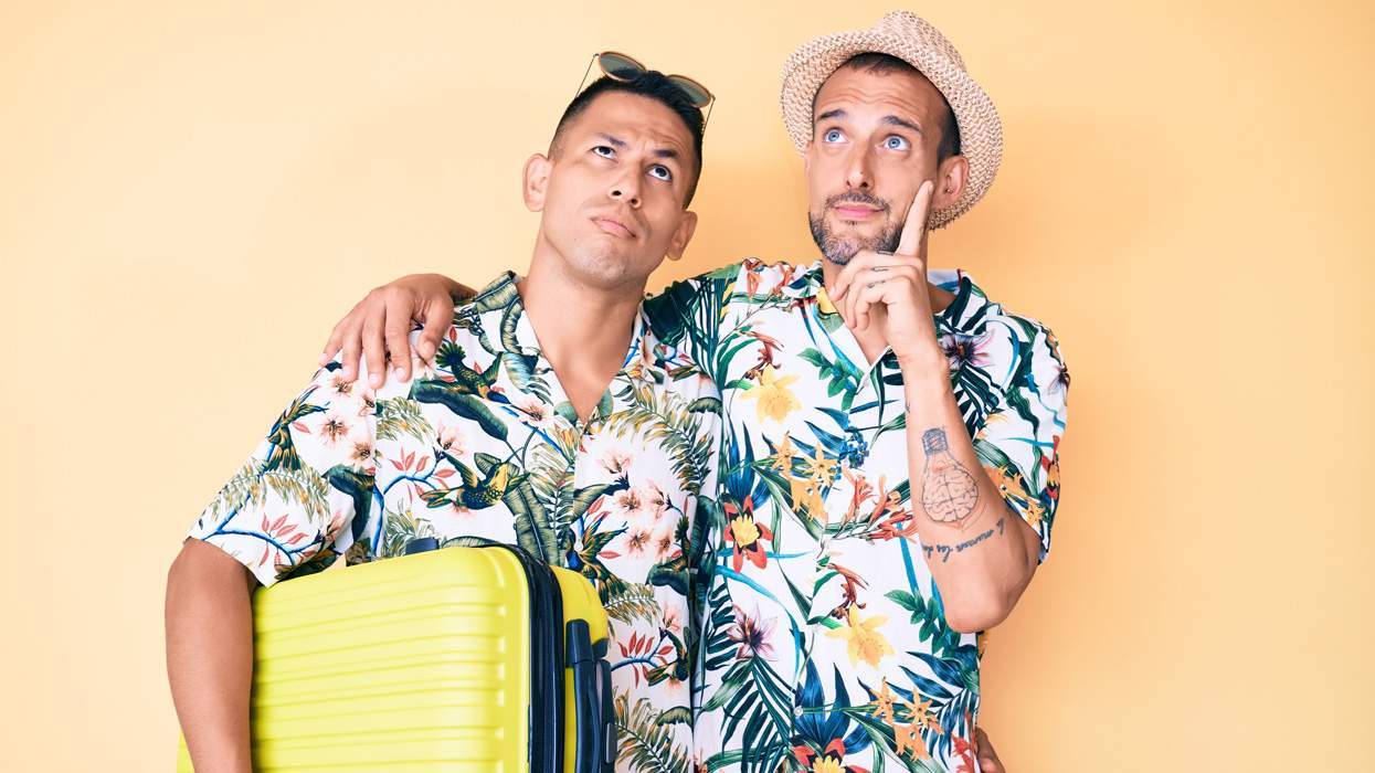 gay couple with suitcase