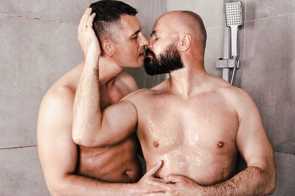 Gay men kissing in the shower