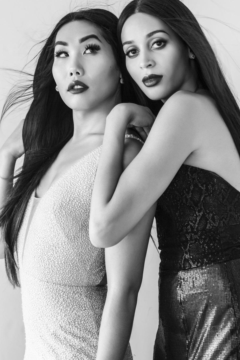 Gia Gunn in Nicole Bakti sequin gown. Isis King in Berenice Gonzalez black gown.