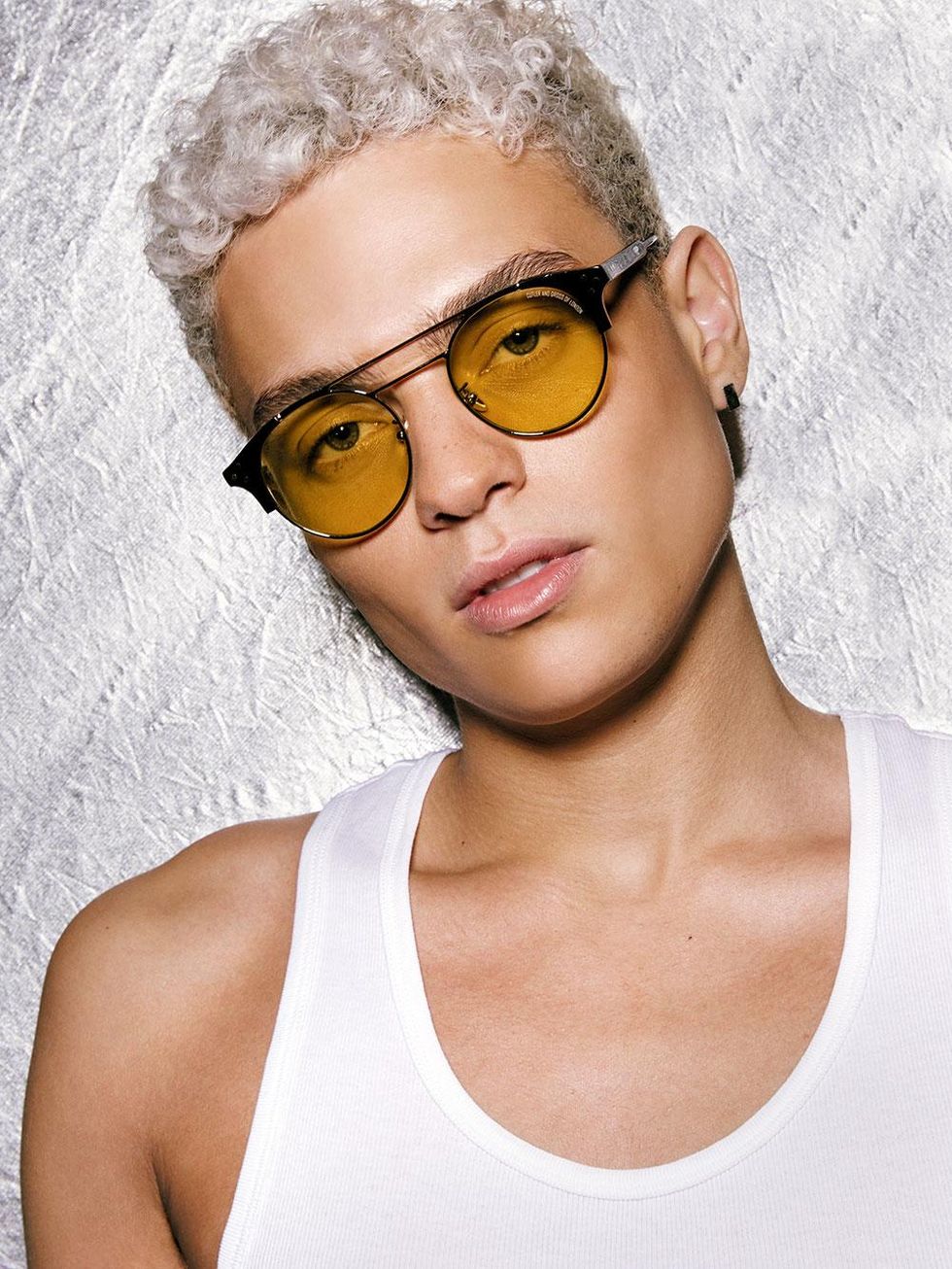 Glasses by Cutler & Gross available at Mr. Porter $445, tank top by Calvin Klein Underwear $39.50 for a pack of three