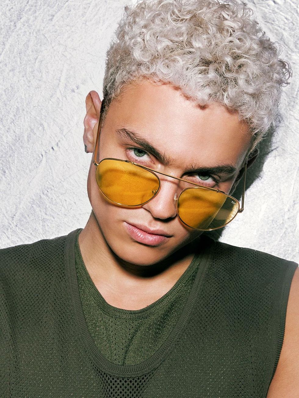 Glasses by Retrosuperfuture $265, tank top by Ermenegildo Zegna Coutoure $890