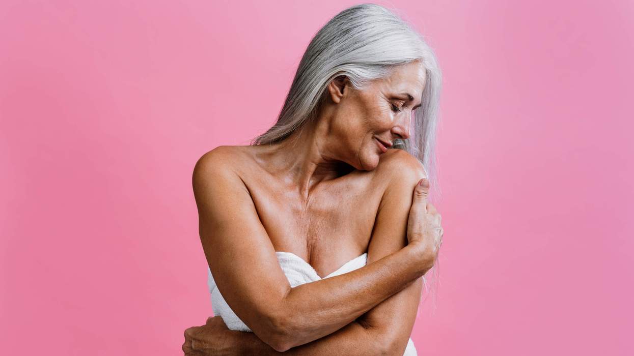 Gray haired woman in a towel