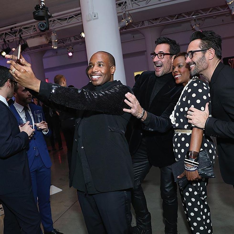 Greg Zarian and Lawrence Zarian pose for a photo with guests