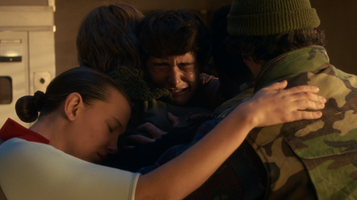 Group of people hugging one person