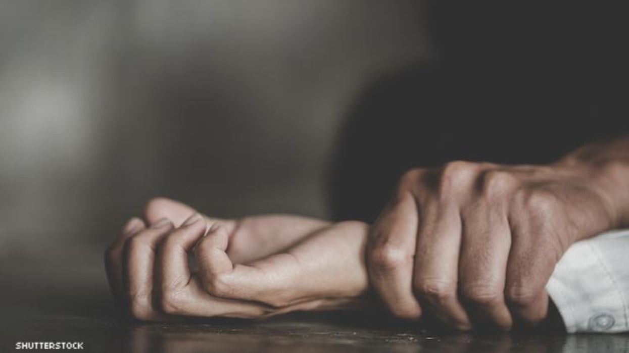 Hands being held down