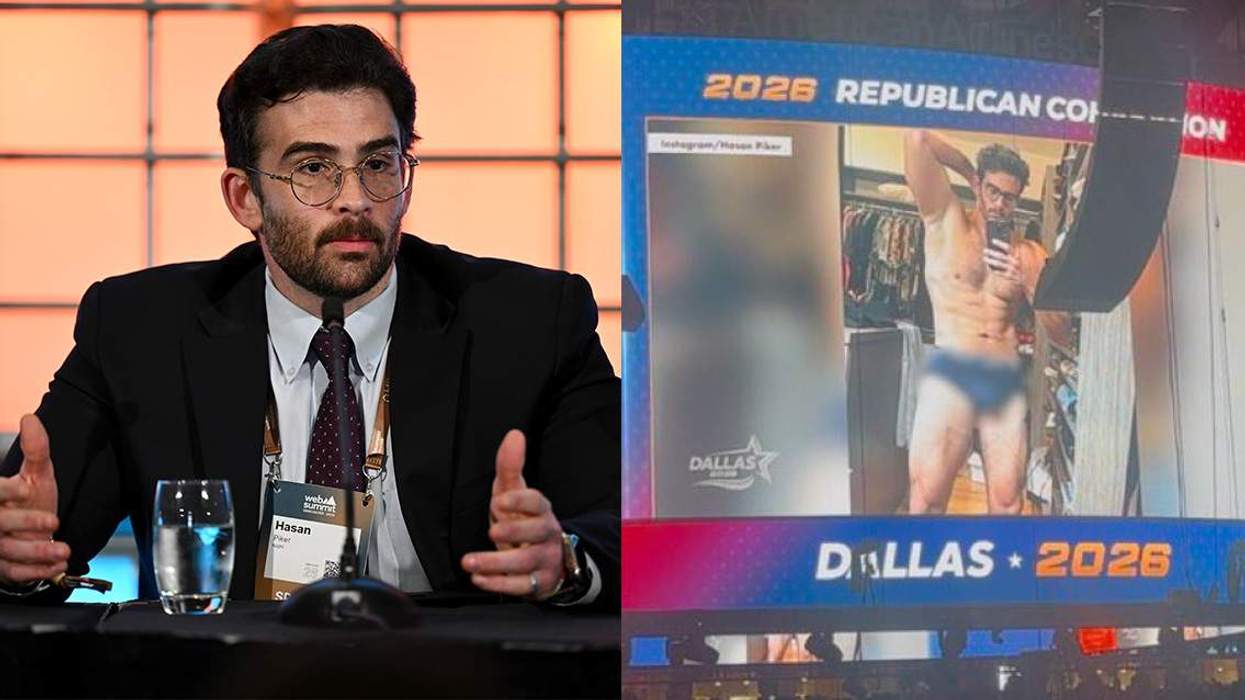 Hasan Piker at a desk and on the giant display screen