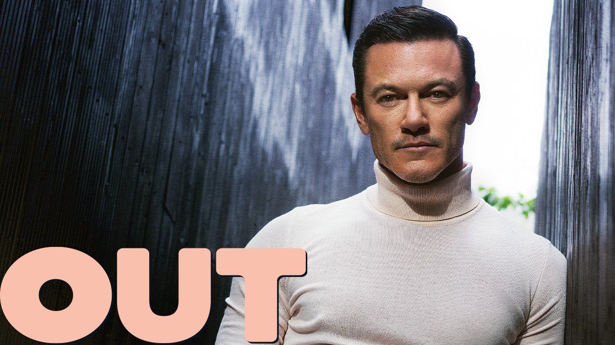 <p><em></em><em>Out</em> cover star Luke Evans had an 'unexpected' path to Hollywood leading man</p>