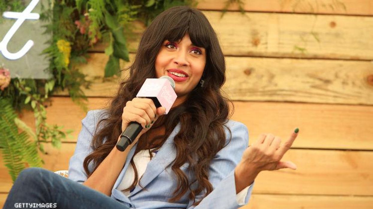 Jameela Jamil speaking into a mic.