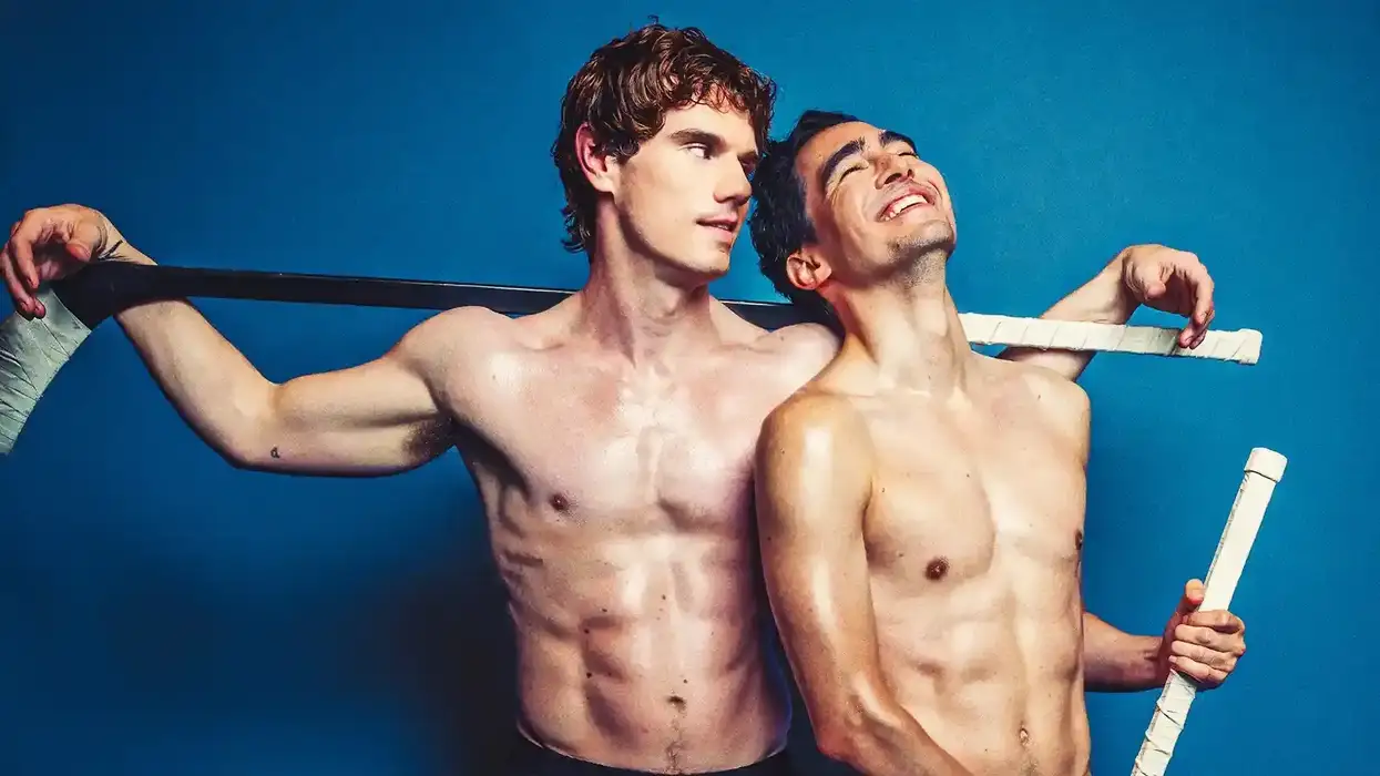 Jay Armstrong Johnson and Troy Iwata shirtless holding hockey sticks