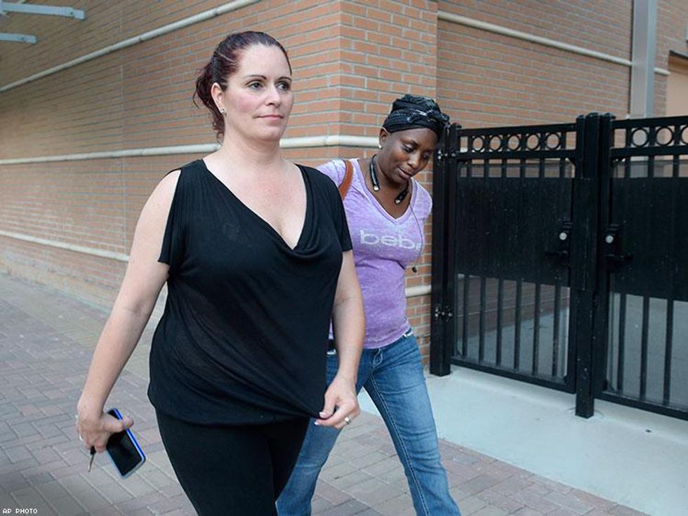 Jennifer Nicholson, left, and Mina Justice head to a briefing for family members at the Orlando Regional Medical Center hospital.
