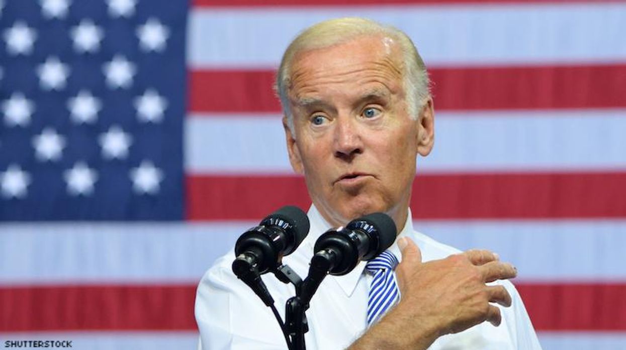 Joe Biden giving speech in front of flag