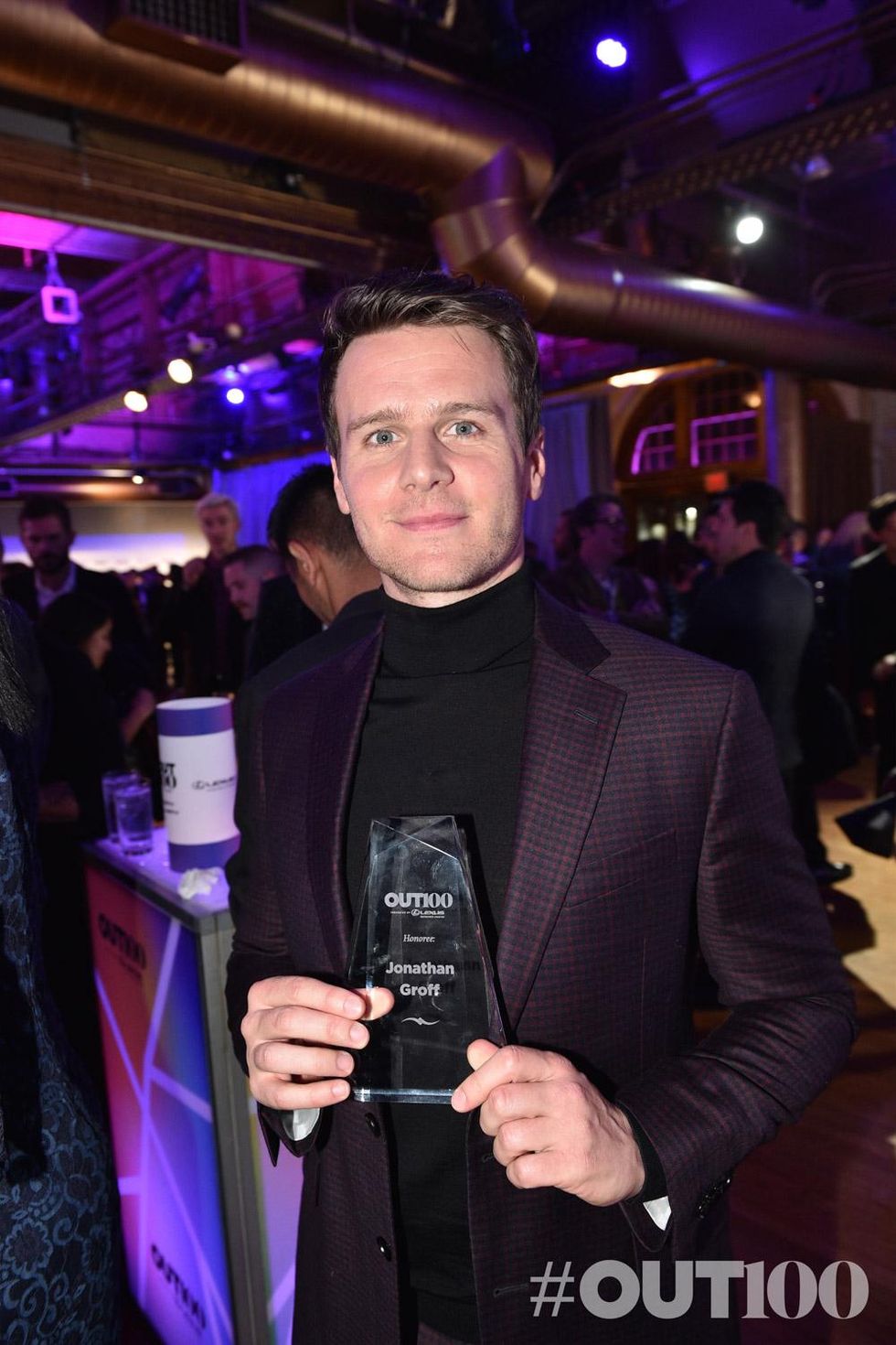 Jonathan Groff accepts The OUT100 Entertainer Of The Year Award