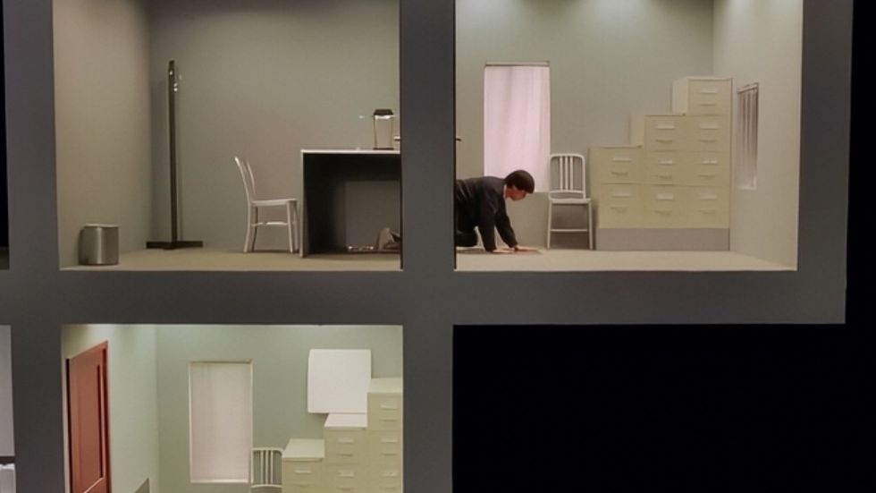 Julio Torres in the maze scene of Problemista