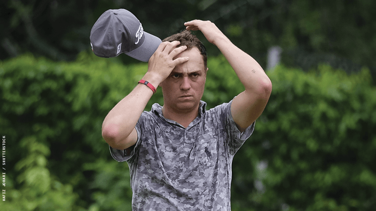 Justin Thomas looking frustrated on the golfing green.