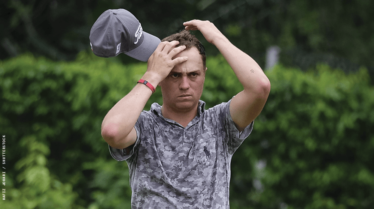 Justin Thomas looking frustrated on the golfing green.