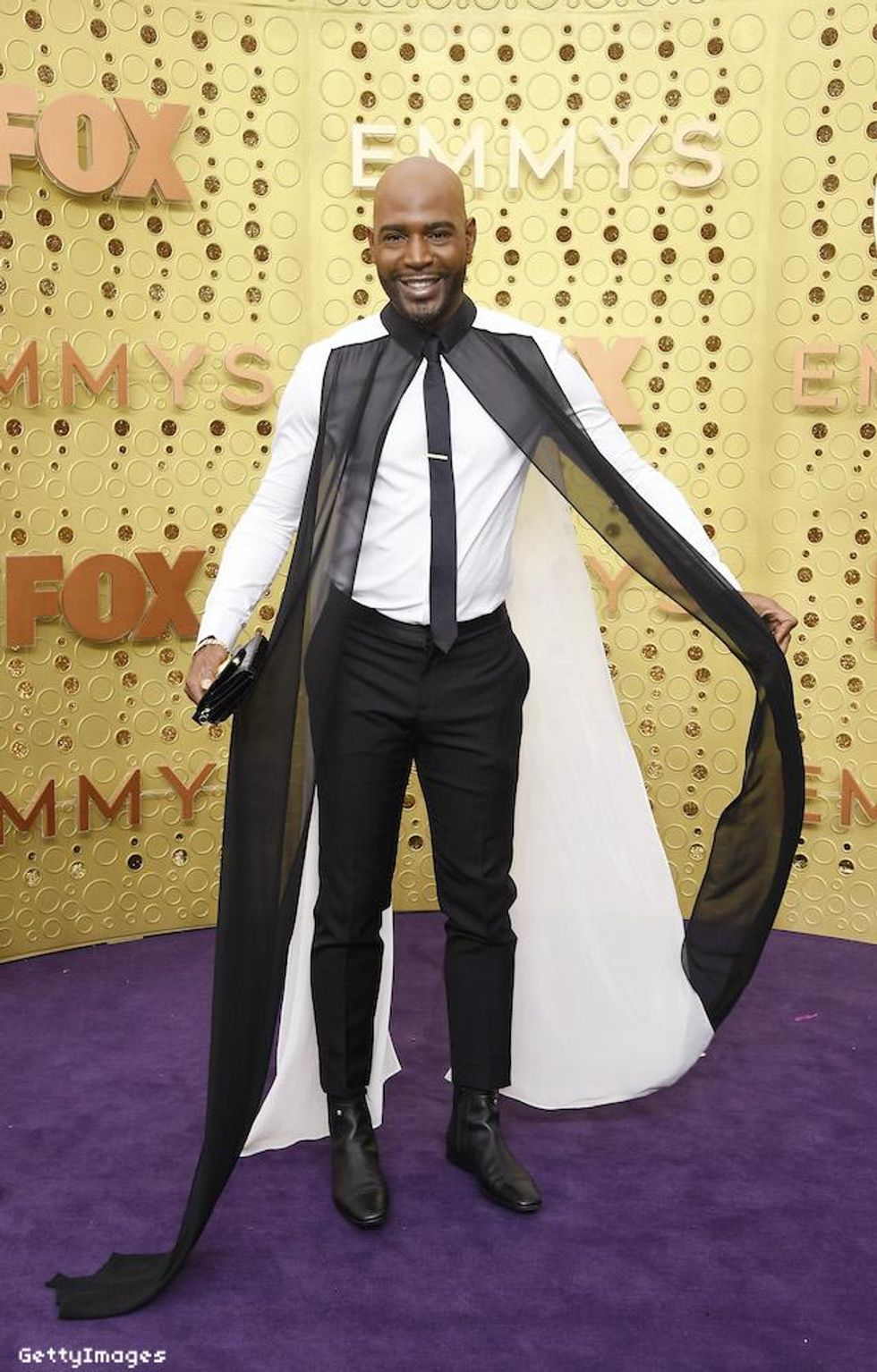 Karamo Brown in Versace and Kaftan Studio