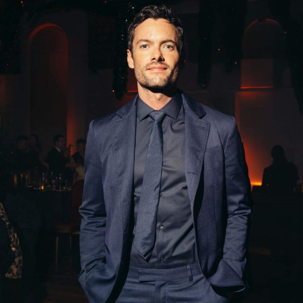 keith edwards wearing a dark suit with a dark shirt and dark tie
