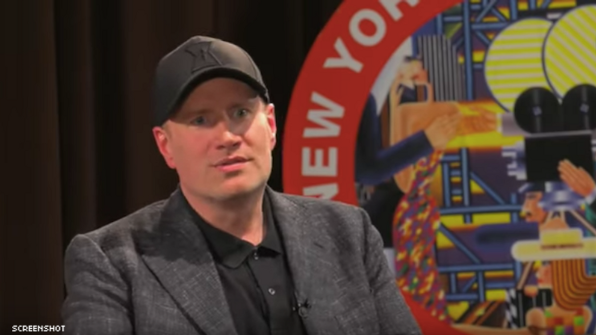Kevin Feige sitting down and speaking with a hat on.