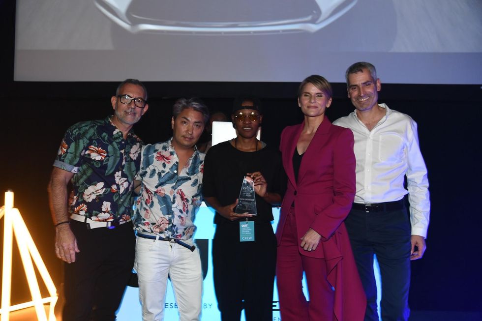 Kris Harring celebrates with the OUT Fashion Vanguard judges
