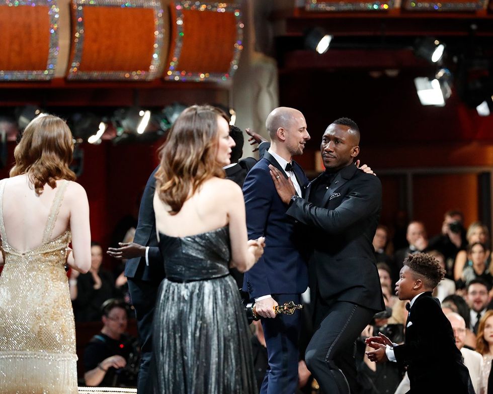 La La Land producer Fred Berger congratulates Moonlight actor Mahershala Ali at the 2017 Academy Awards