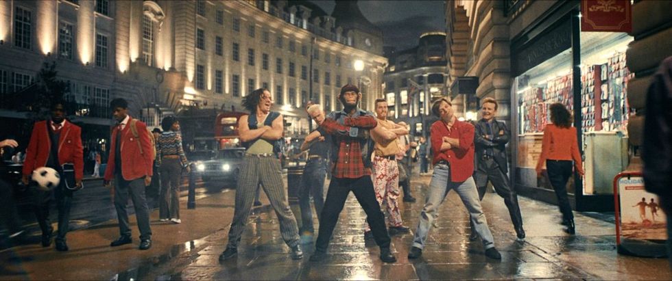 Liam Head as Howard Donald, Jake Simmance as Gary Barlow, Jonno Davies as Robbie Williams, Chase Vollenweider as Jason Orange, Jesse Hyde as Mark Owen, and Damon Herriman as Nigel Martin Smith in Better Man in Better Man