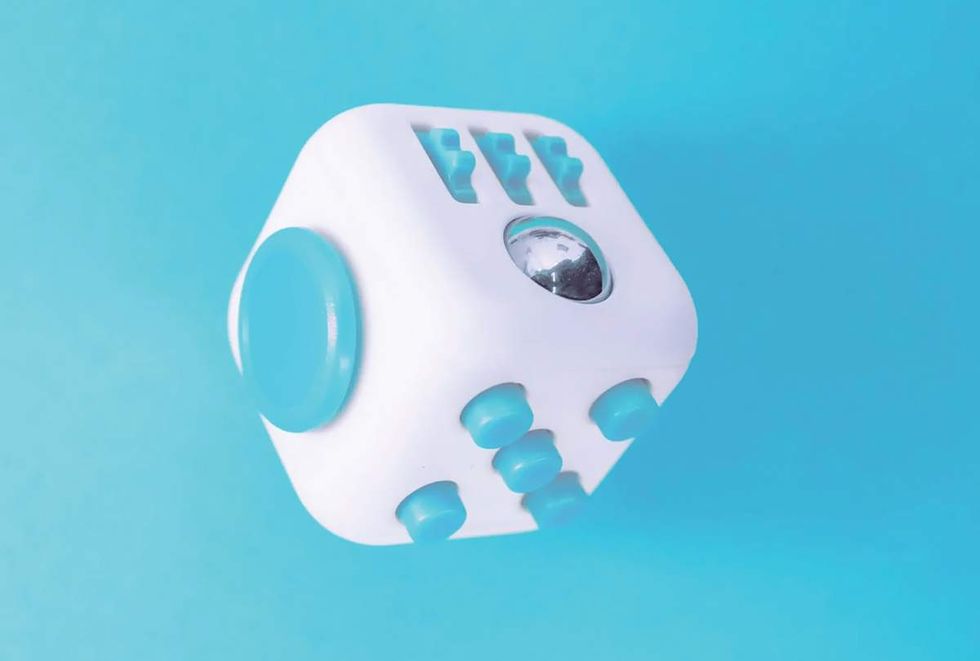 light blue and white Fidget Cube by Antsy Labs