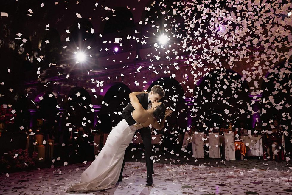 Luke Lowrey and Damian Terriquez kissing at their wedding