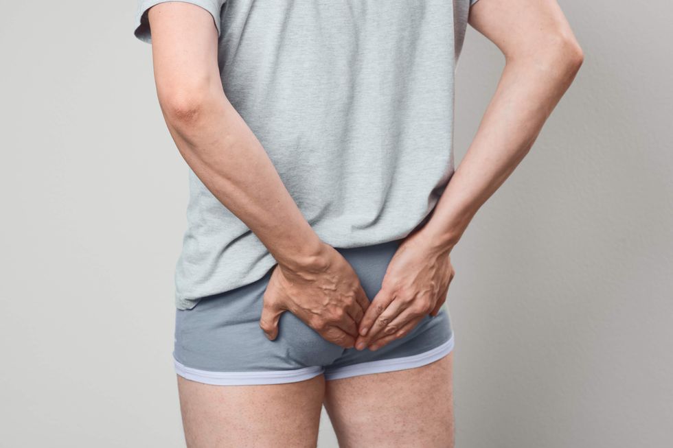 Man grabbing his butt